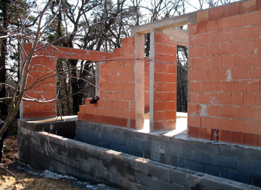 Load-bearing internal walls are constructed from ceramic bricks thickness 300 mm and 11 rows height