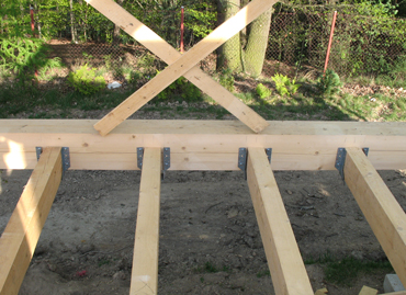 Floor joists are fitted to ground floor supporting frame by sheets BOVA