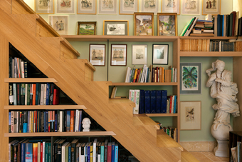 Staircase to the gallery consists of a large library