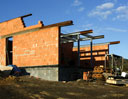 Ground floor: brickwork and visible steel - wooden ceiling 